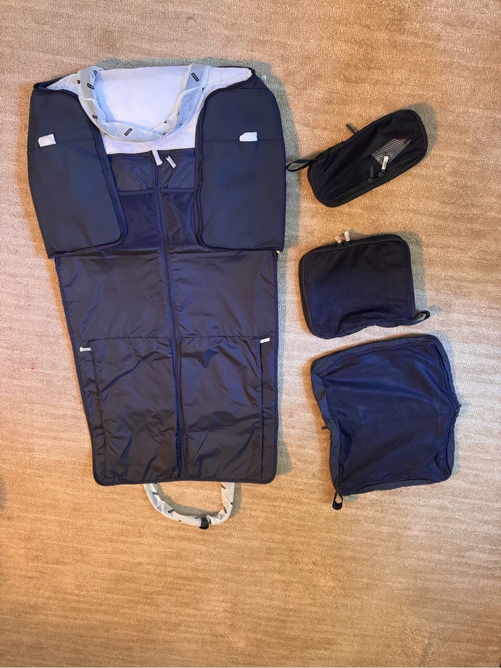 Away Navy Blue Garment Duffle with Black Handles and packing cubes